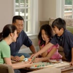 Family_playing_a_board_game_(3)
