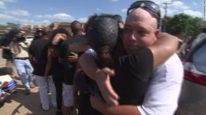 Dallas protesters hug