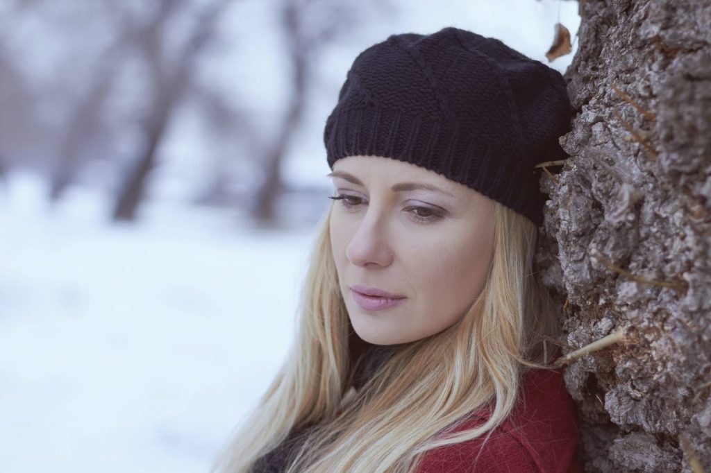 sad woman in snow blonde
