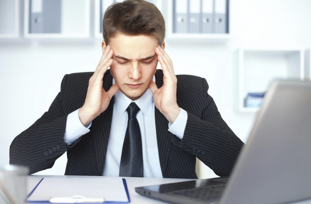 man stressed at work