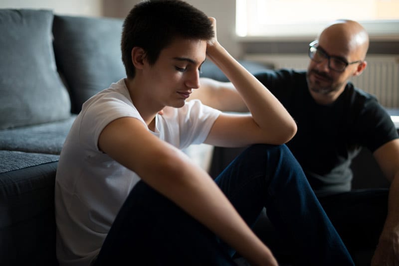 Man Helping a Family Member in Psychosis