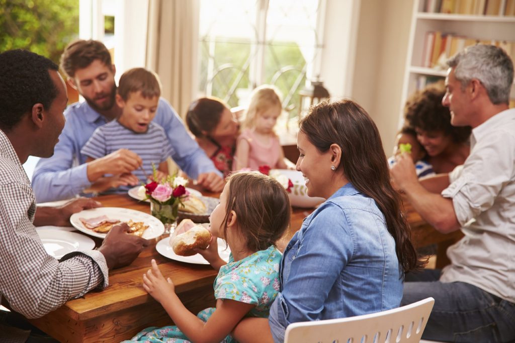 family and friends sitting at a dining table