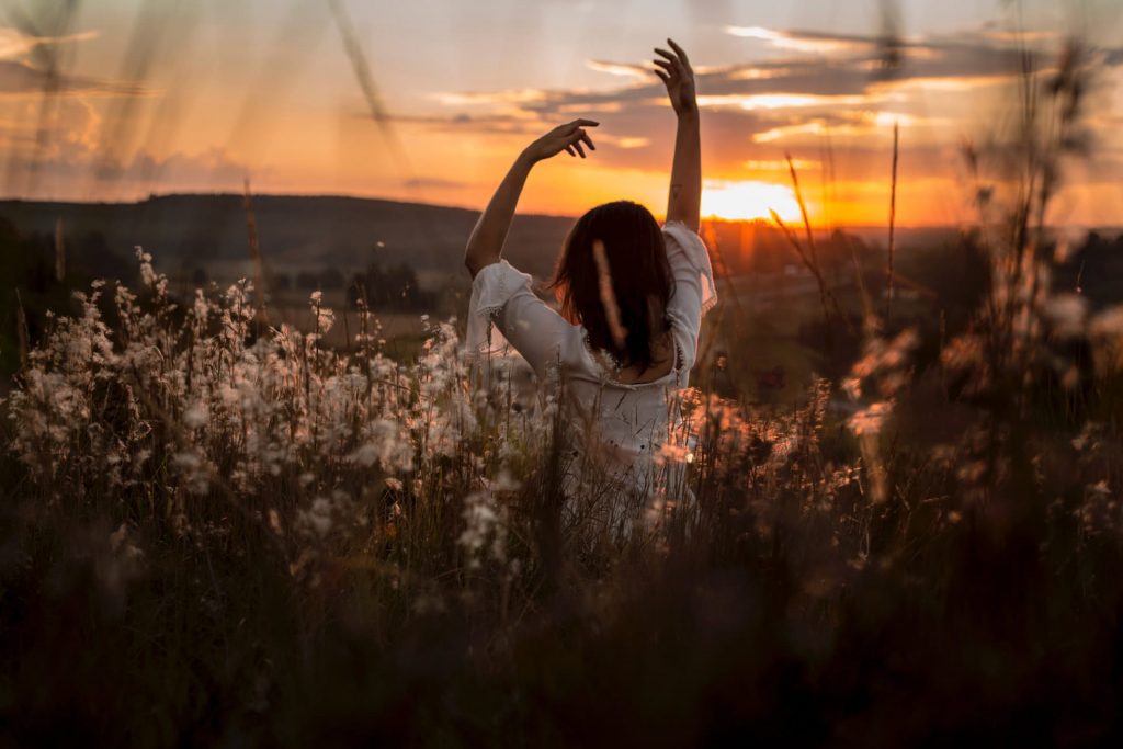 BipolarDisorderandCreativity - Sunset with girl in field