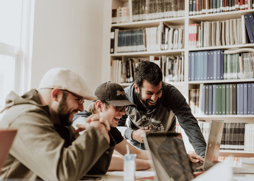 group of college students having fun while studying