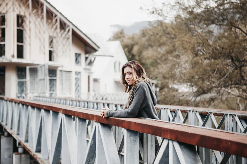 Sad girl on bridge