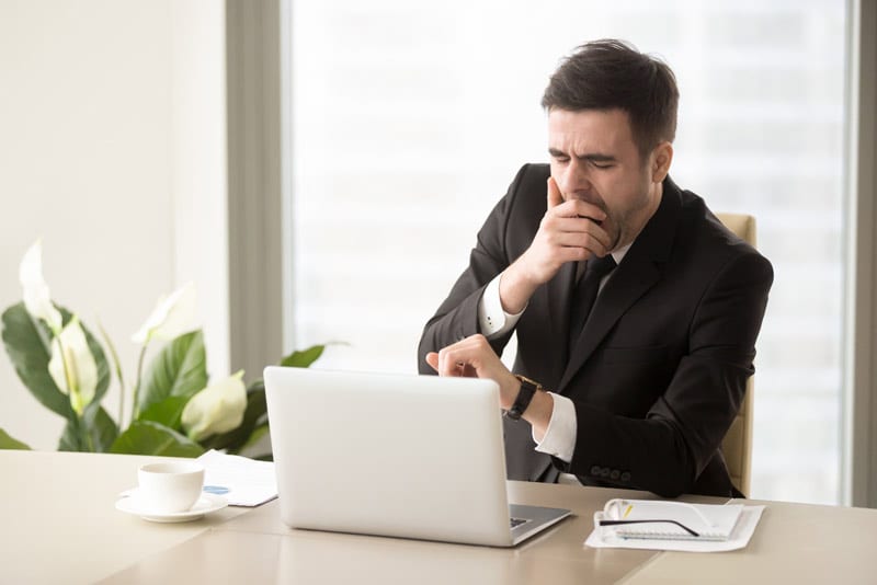 tired man at computer