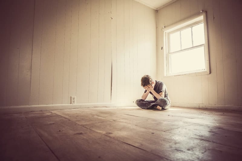 man alone in empty room
