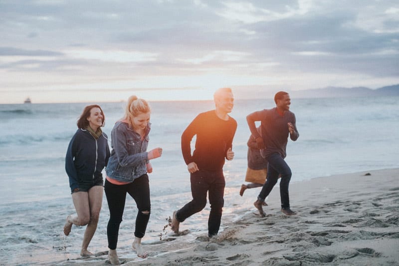friends running on beach