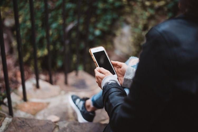 online counseling on phone outdoors