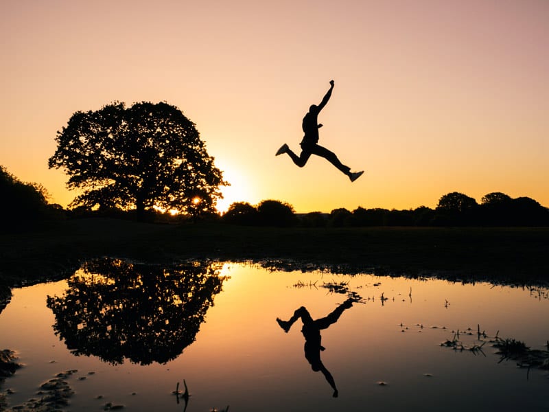 leaping man at sunset