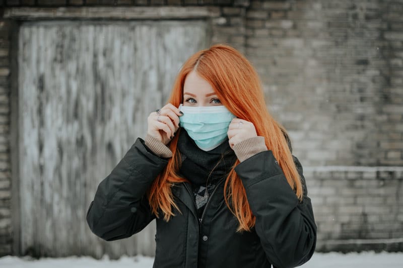 young woman with covid mask
