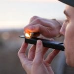young man with cannabis pipe