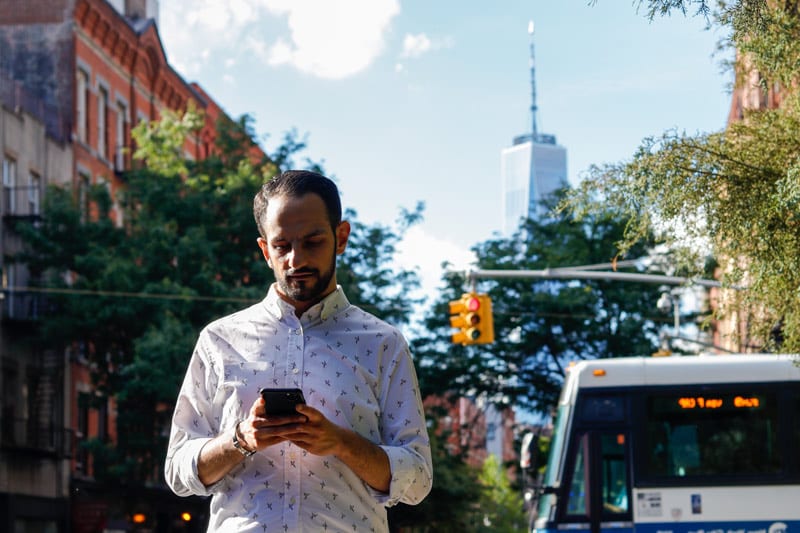 distracted man with smartphone