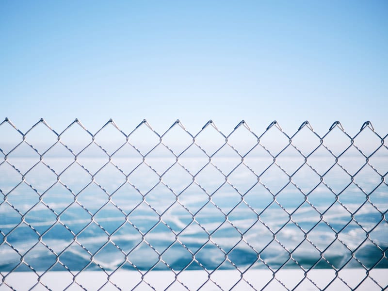 chain link fence on water