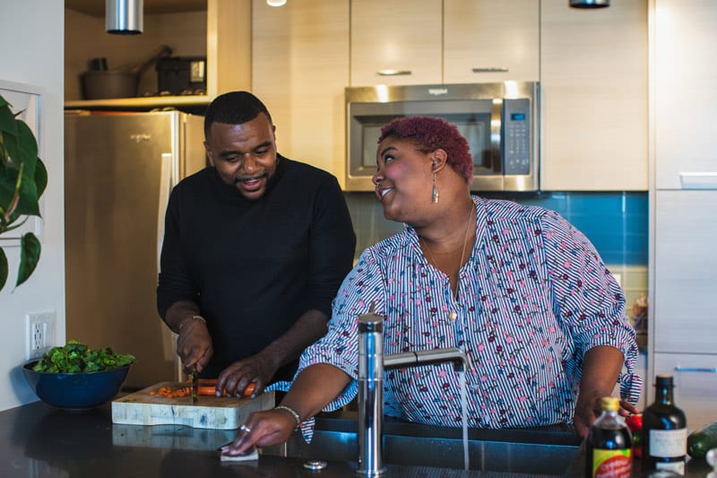 black couple cooking