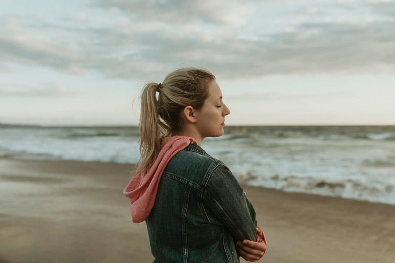 mindful woman on beach