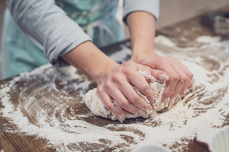 hands kneading dough