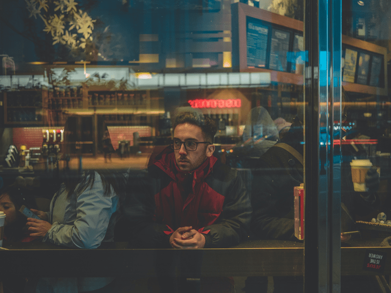 man sitting in café