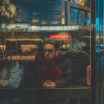 man sitting in café