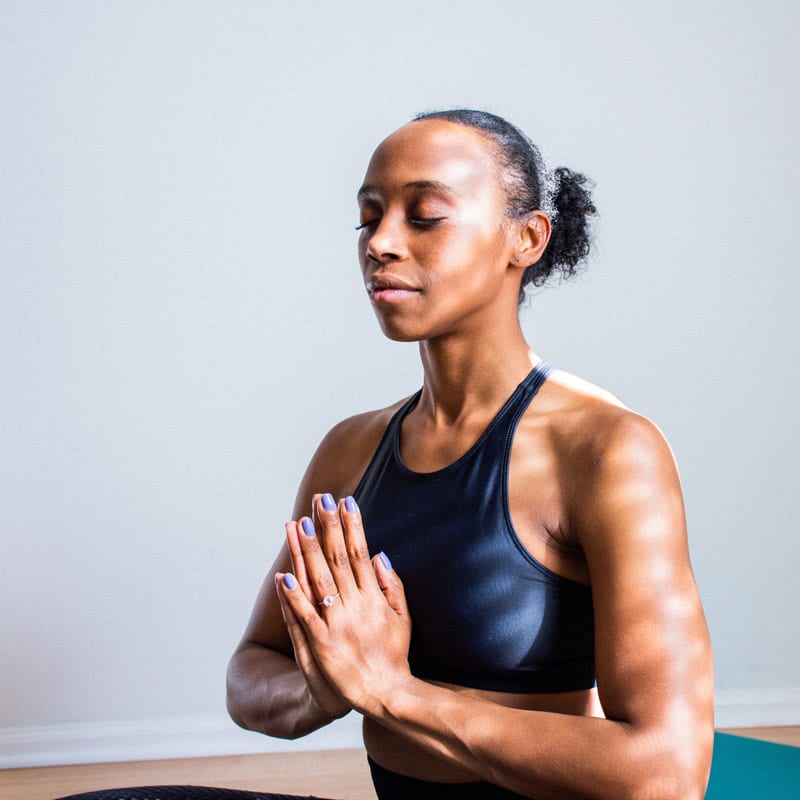 black woman doing yoga