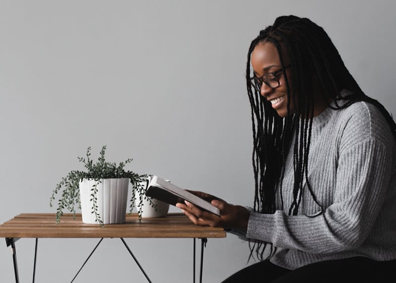 black woman reading