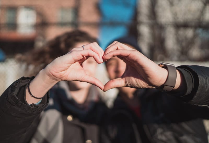 couple making heart sign