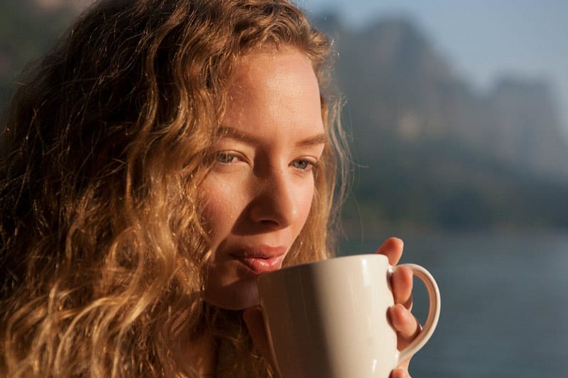 thoughtful woman drinking coffee