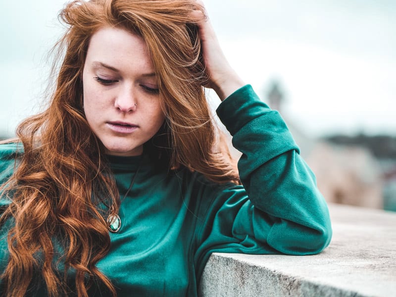 young woman in baggy sweater