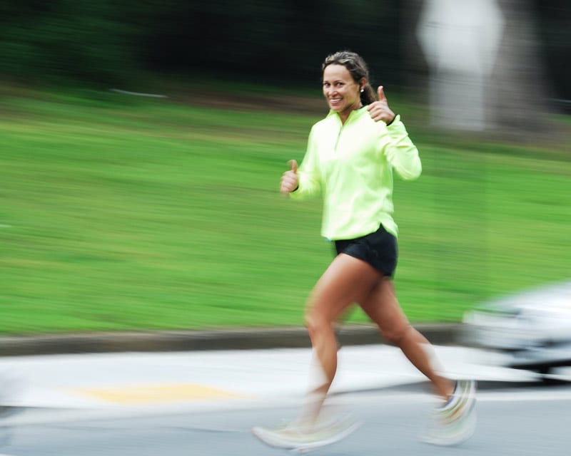 woman runner with thumb up