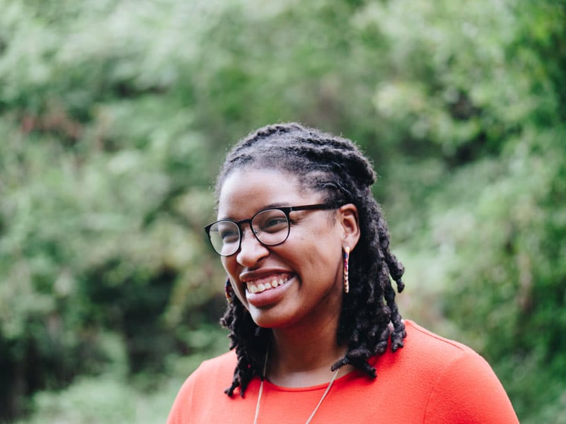 smiling black woman with glasses