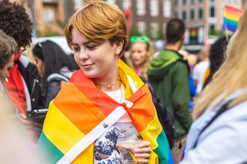 young person in pride flag