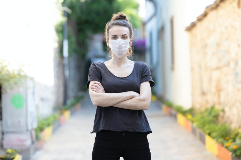 woman in black shirt and mask