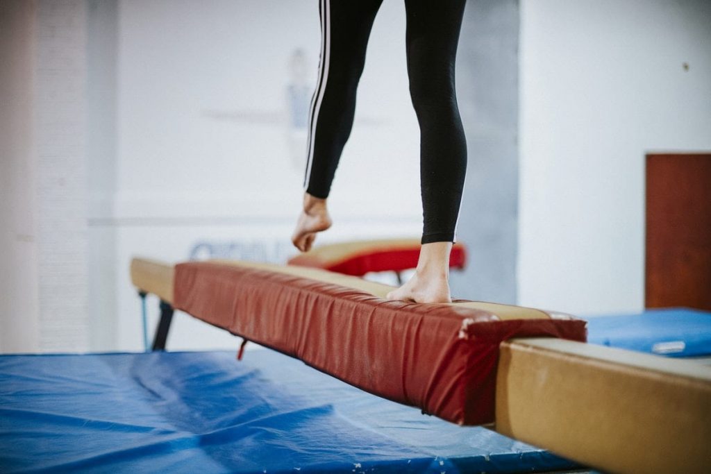 gymnast legs on balance beam