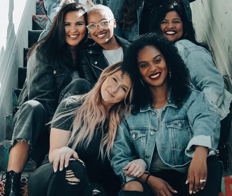 multi-racial women on steps