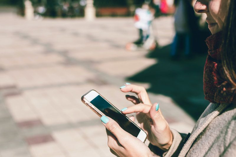 woman holding smartphone