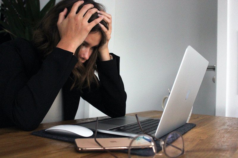 stressed woman at laptop