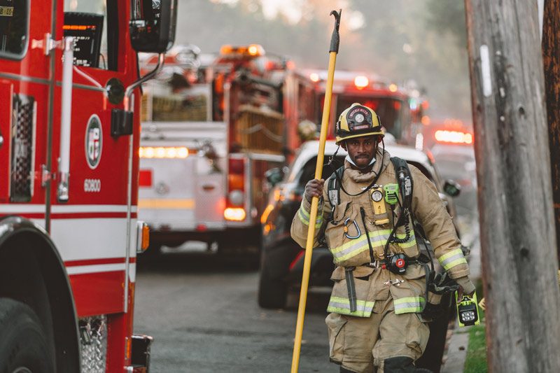 black firefighter with gear.