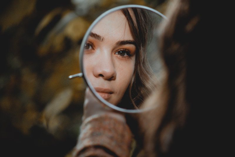 woman’s face in mirror
