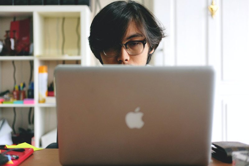 Asian student with laptop