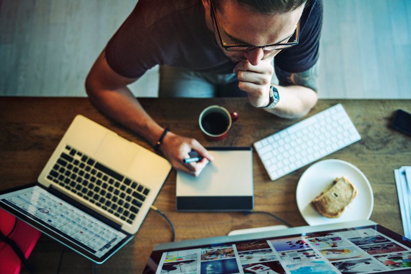 man at work with multiple devices