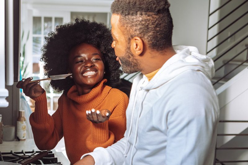 black couple cooking