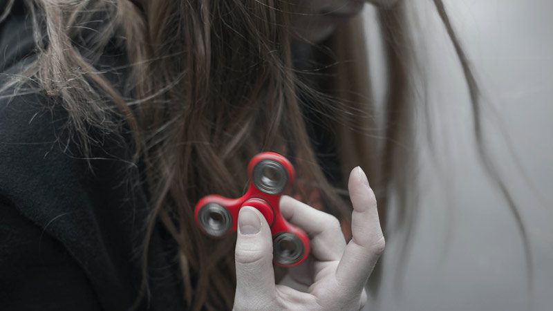 person holding fidget toy
