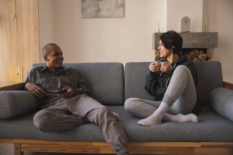 multiracial couple on couch