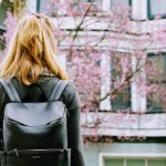 girl with black backpack