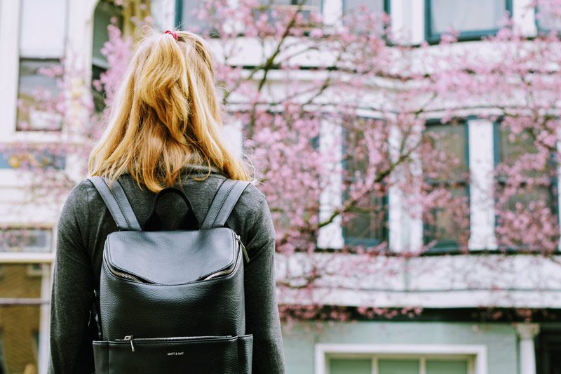 girl with black backpack