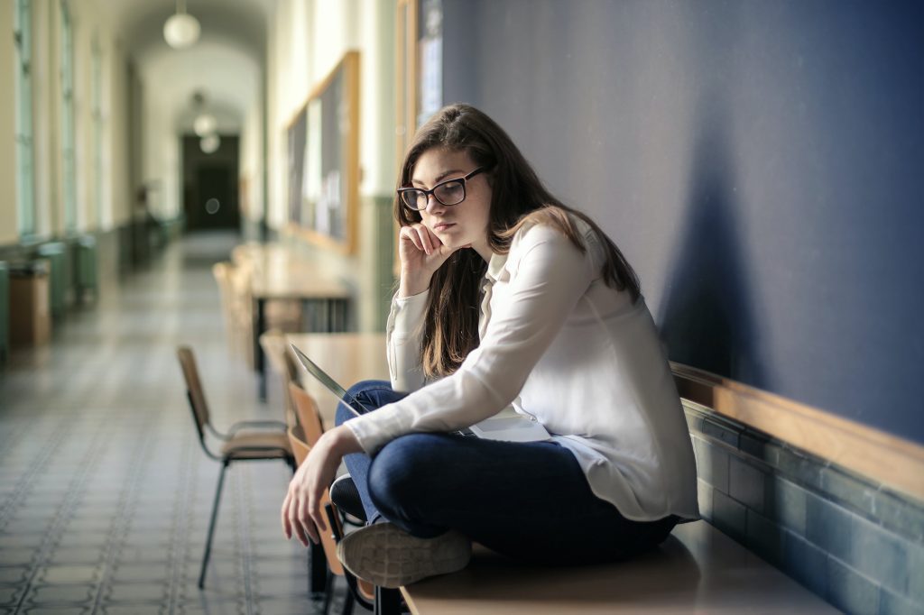 sad teen at school