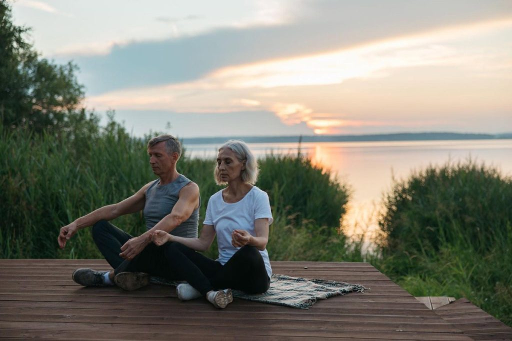 sitting cliff side at sunrise