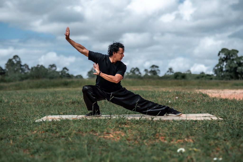 man doing tai chi outdoors