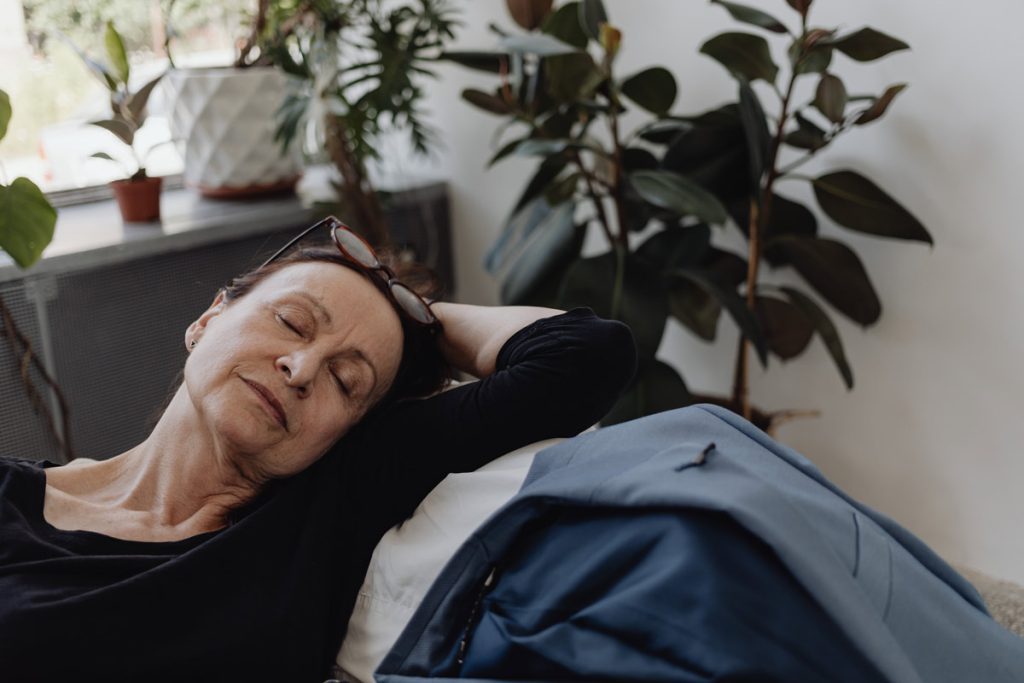 tired woman on couch