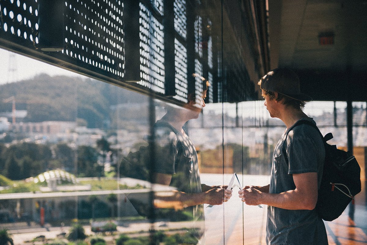 man standing in front of window